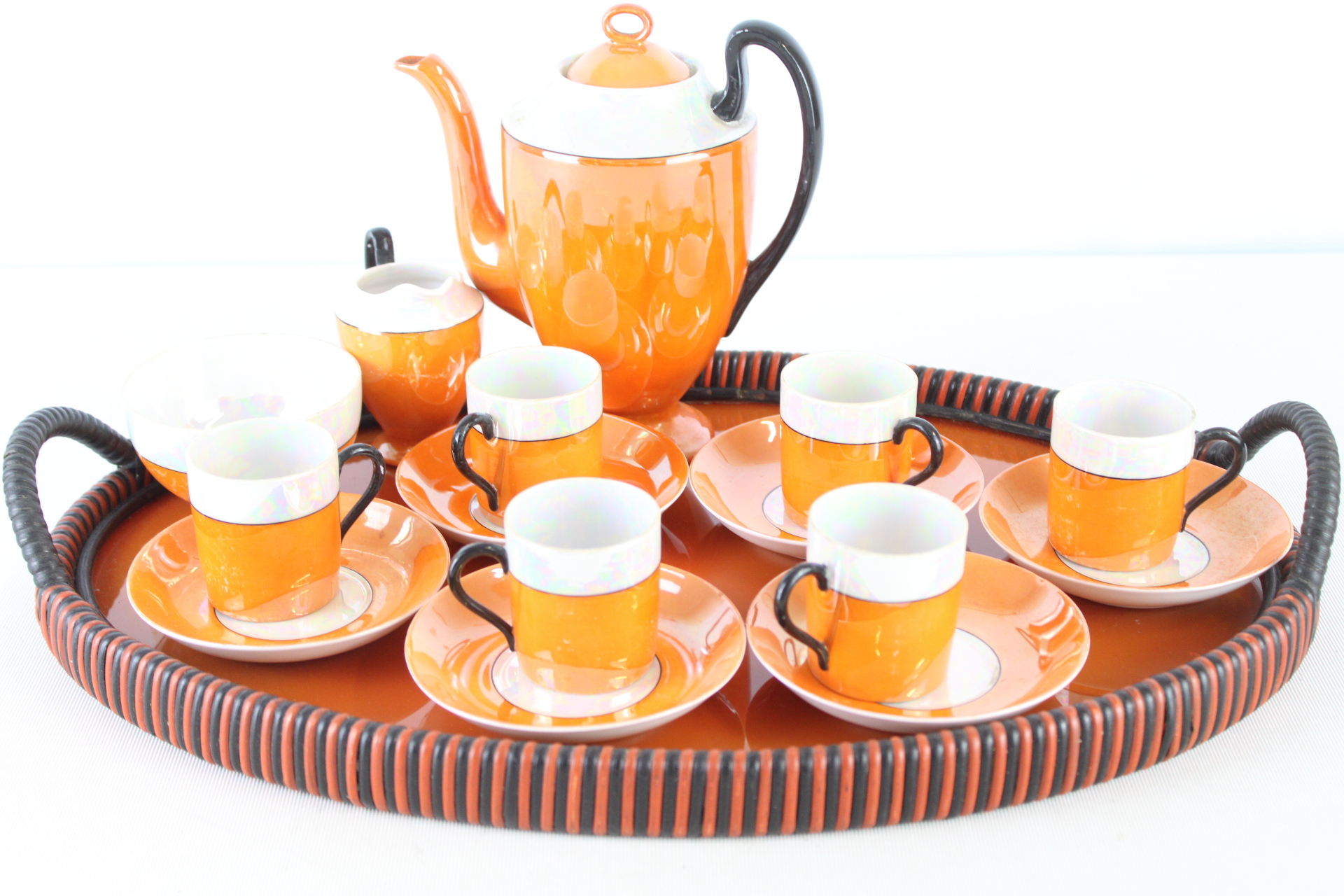 A Set of Art Deco Orange and White Luster Porcelain Coffee Service Pieces and Tray