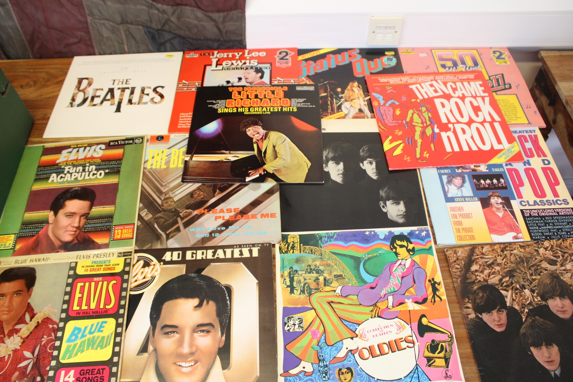 A Collection of Vintage Rock and Roll and Pop Vinyl LP Records Featuring The Beatles and Elvis Presley