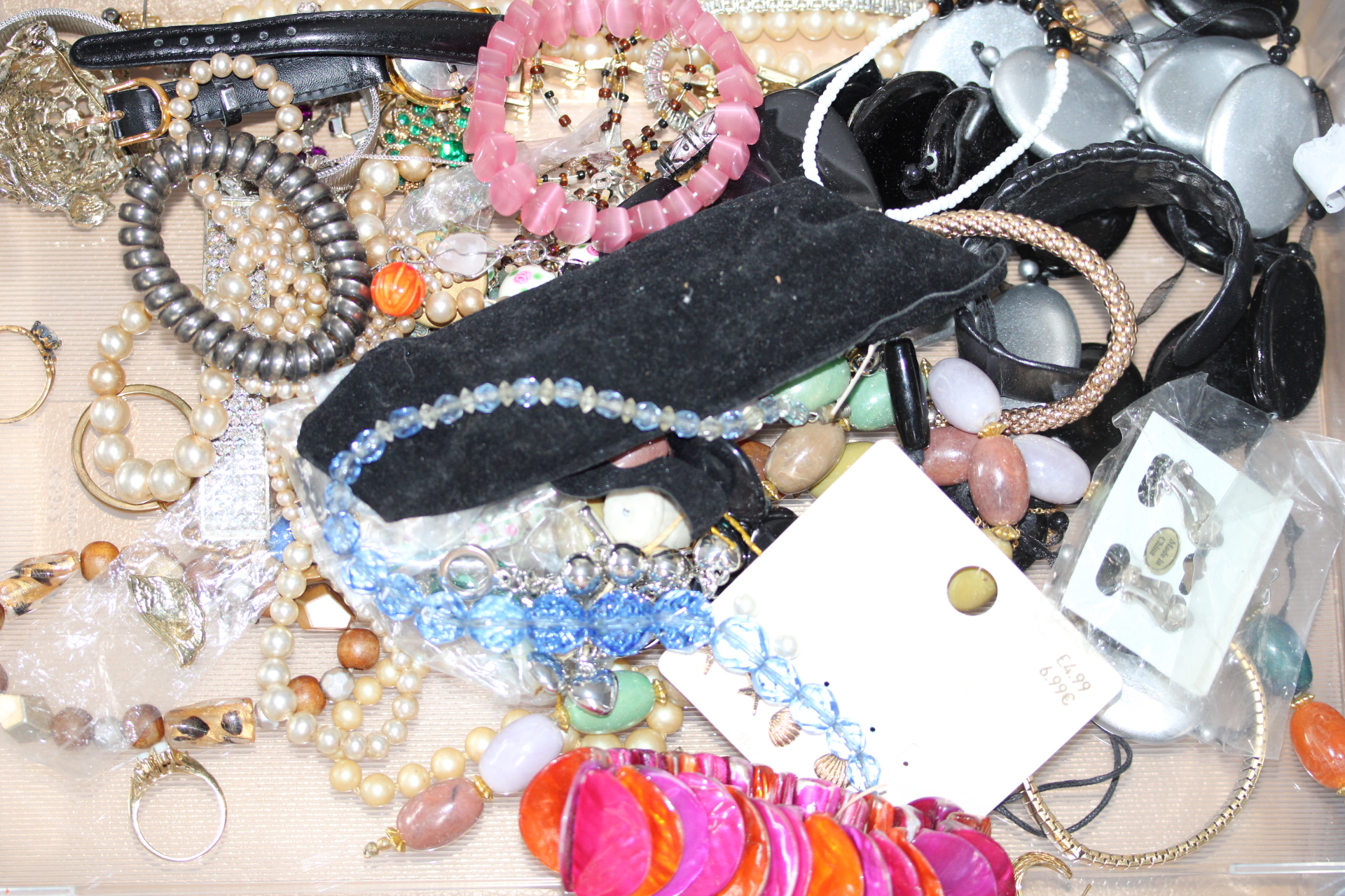 Large unsorted box of costume jewellery