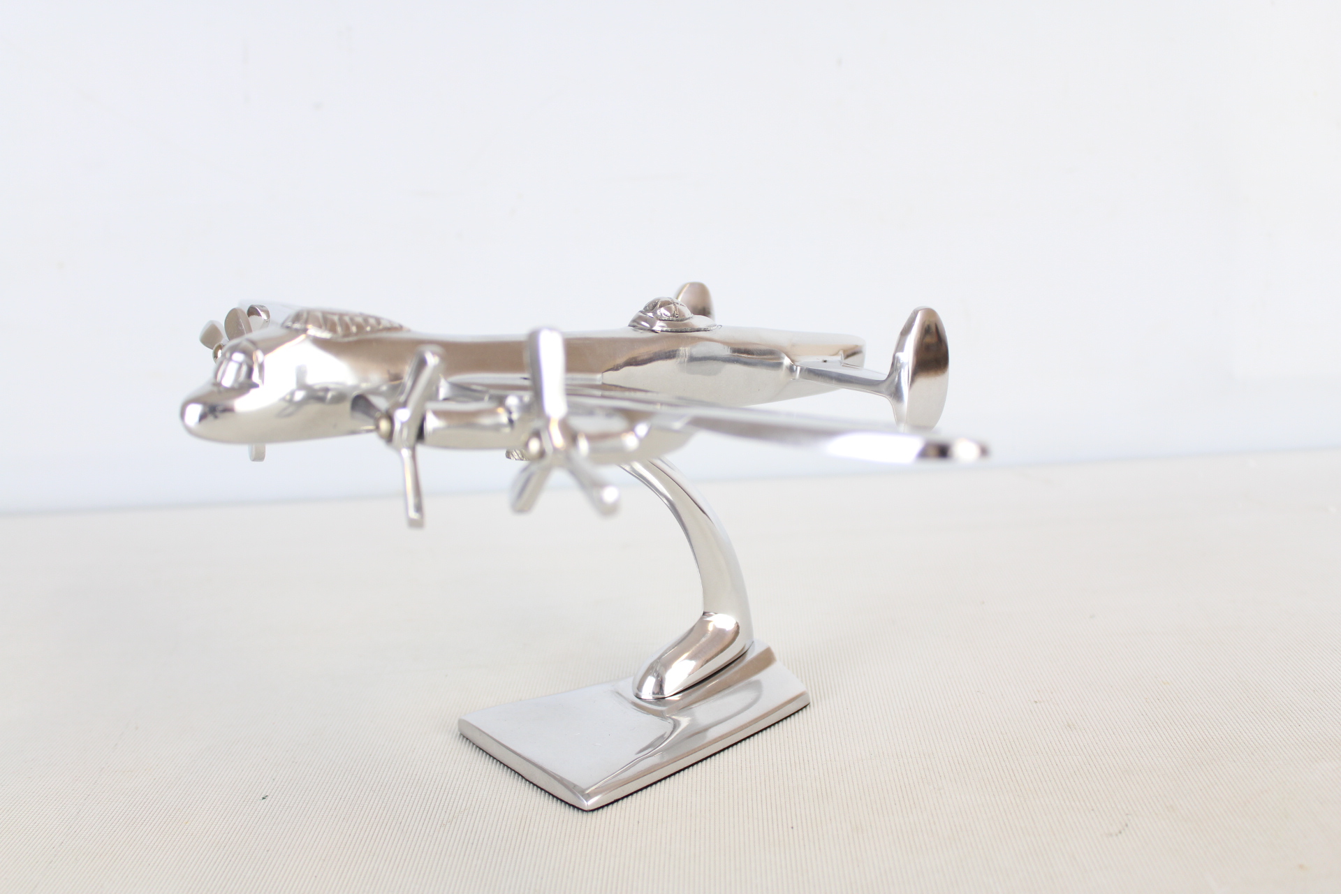 Chrome Lancaster bomber on stand