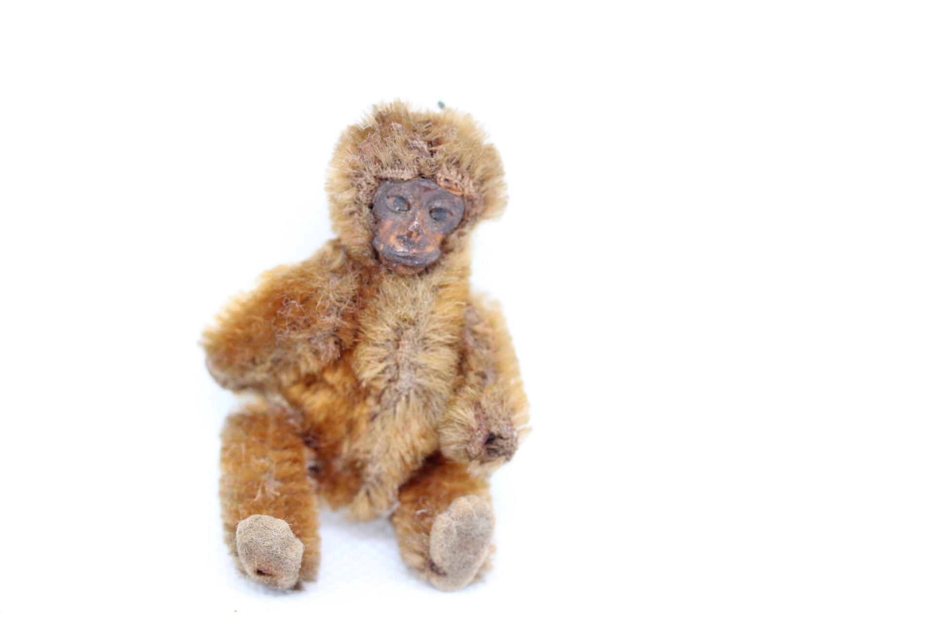 Very early miniature monkey with metal face