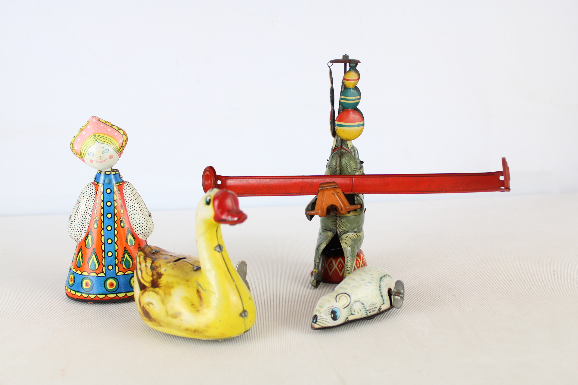A Group of Mid-20th Century tin toys - See-Saw and Duck A.F