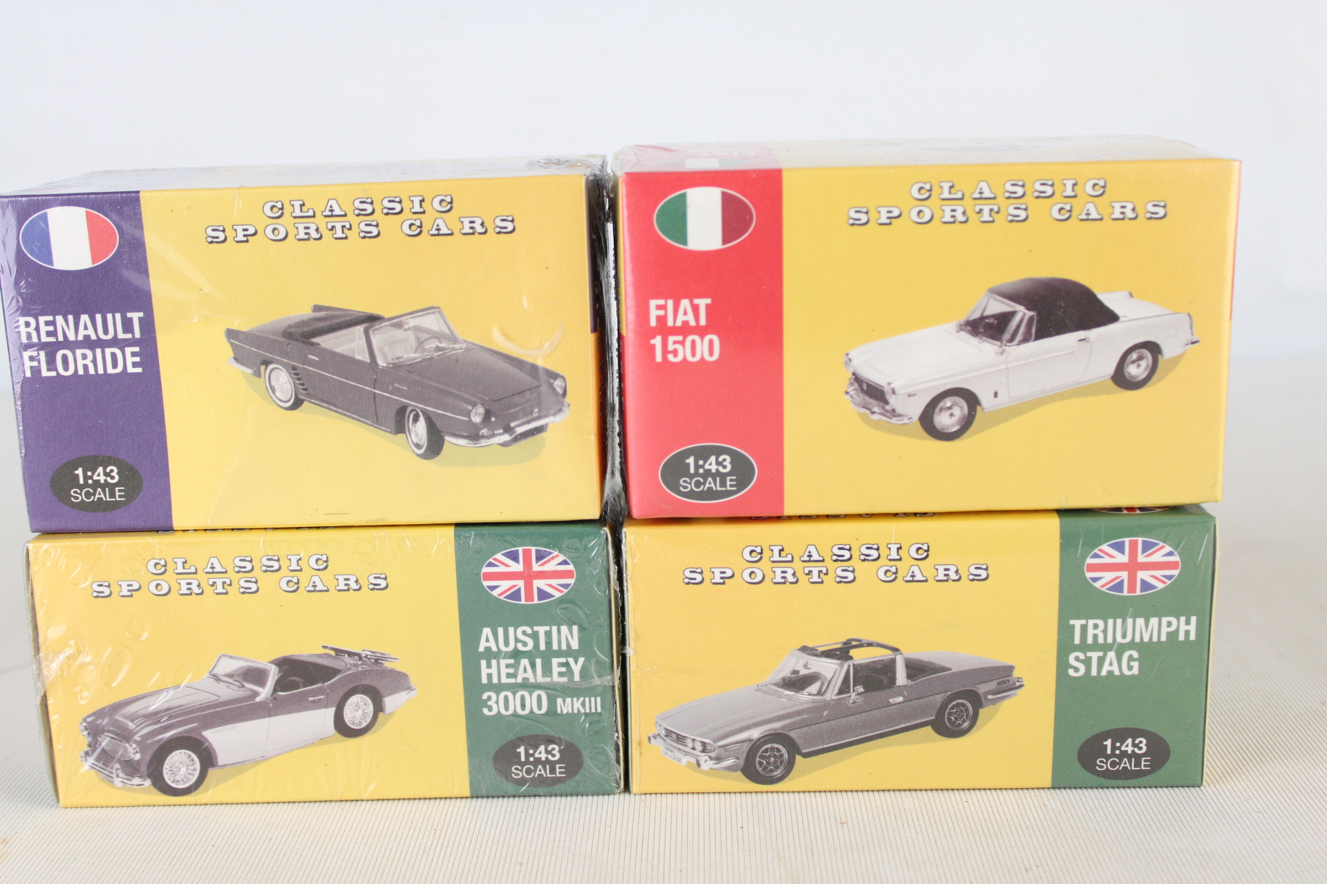 A Set of four Classic Sports Cars die-cast model cars in Original Retail Box