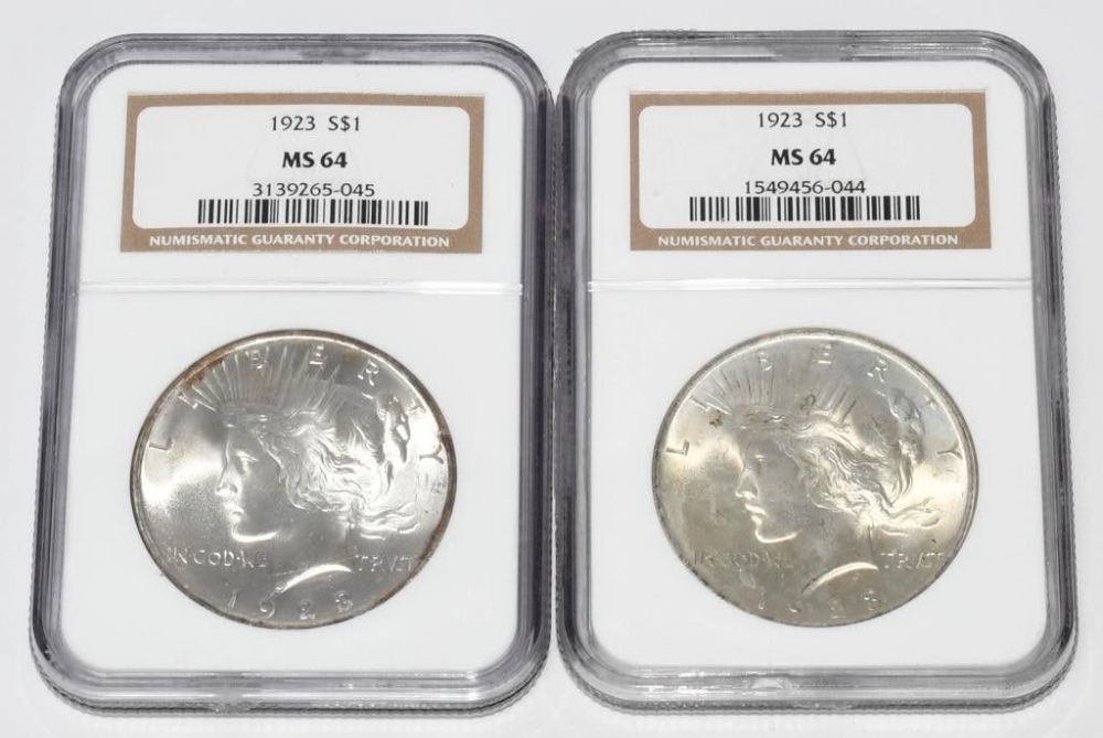 Lot 278: 2 NGC Graded Liberty Silver Peace Dollar Coins