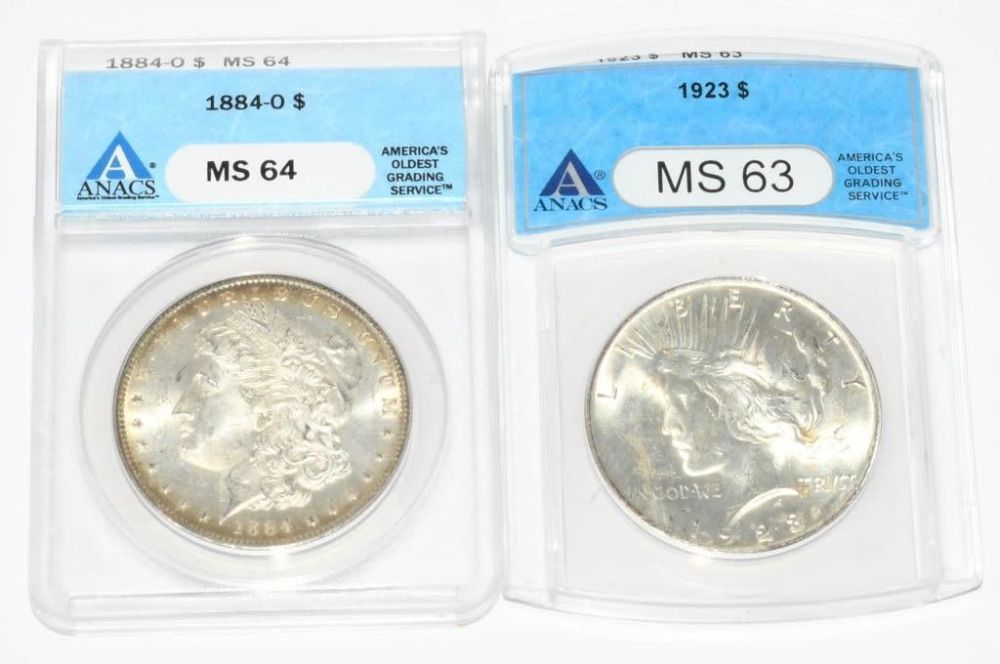 Lot 398: 2 Graded ANACS Coins Peace Dollar & Morgan Dollar