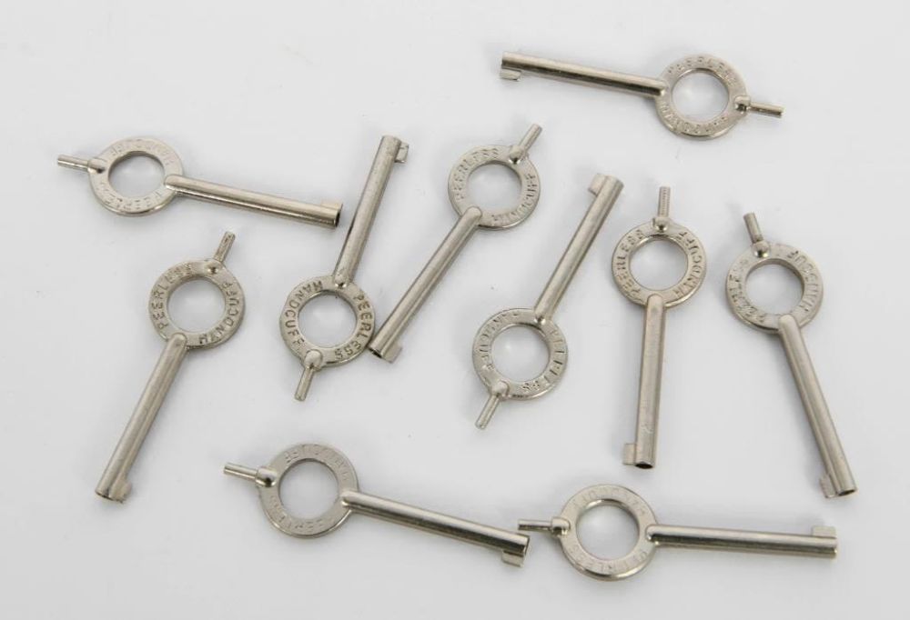 Lot 58: (10) Peerless  Standard Handcuff Keys