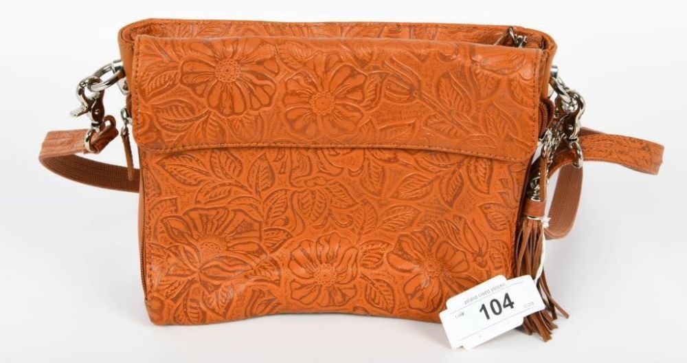 Lot 104: Gun Tote'n Mamas Tooled Concealed Carry Handbag, The...