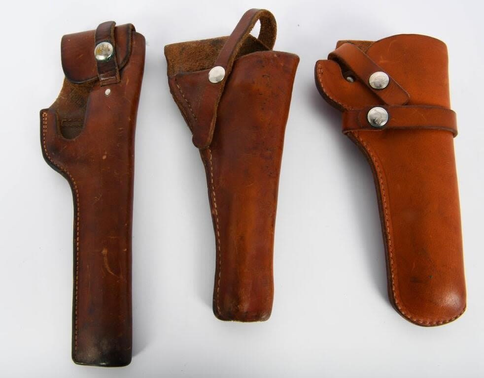 Lot 1148: Three Leather Holsters