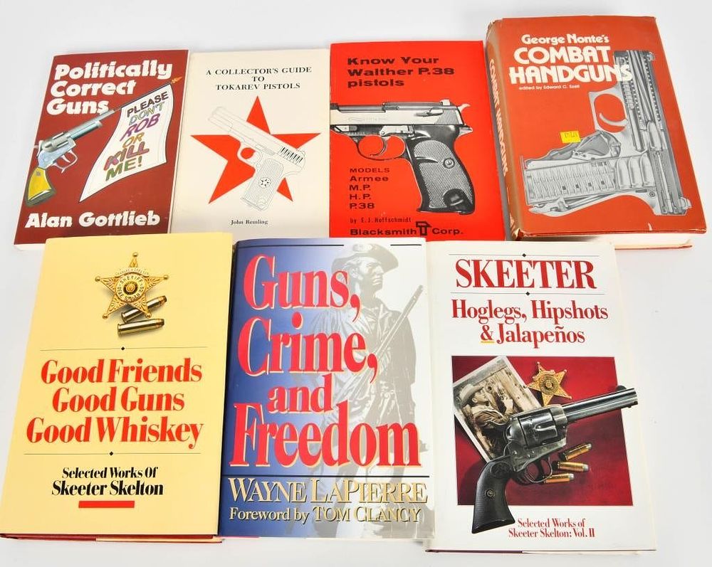 Lot 1055: 4 Hardcover Gun Books and 3 Soft Cover Gun books s