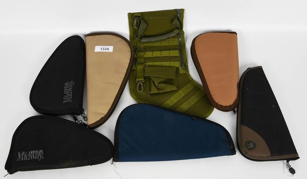 Lot 1334: 6 Soft Pistol Cases and Tactical Xmas Stocking