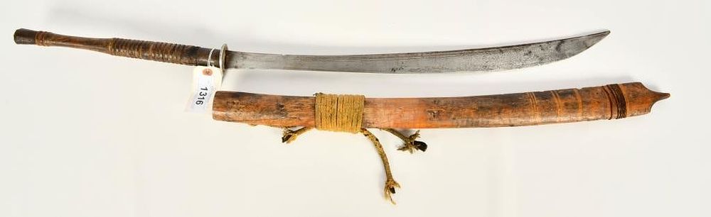 Lot 1316: East African Long Blade sword W/ wood scabbard