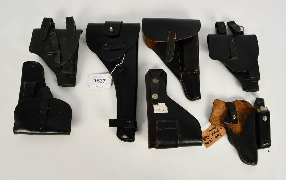 Lot 1537: (7) Various Blk Leather Holsters (1) P38 war bird