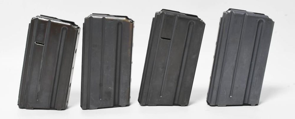 Lot 209: 4 Colt Marked AR-15 20 Round Metal Magazines