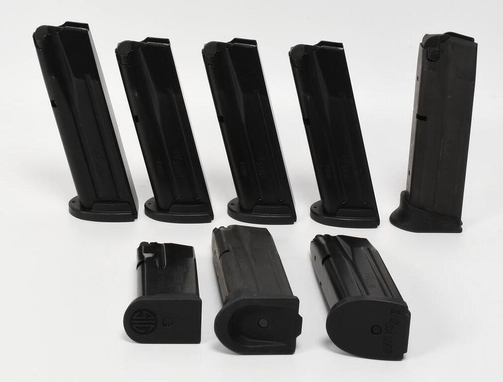Lot 248: 8 Sig Sauer 9mm Metal Magazines