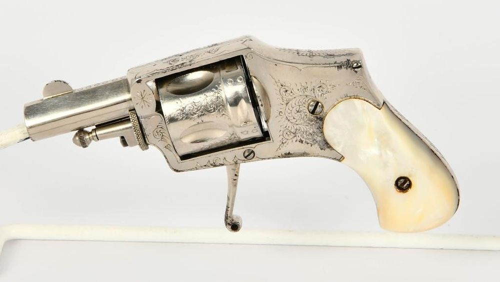 Lot 649: Engraved Nickel ELG Belgian Velodog .32