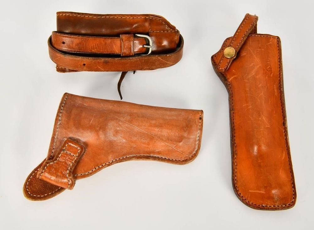 Lot 584: 2 Leather Holsters & 1 Leather Rifle Sling