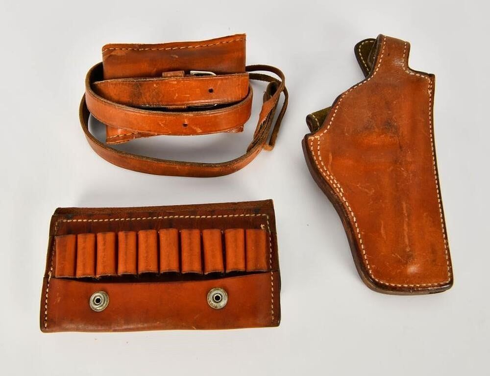 Lot 1283: Leather Holster , Ammo Holster & Leather Sling