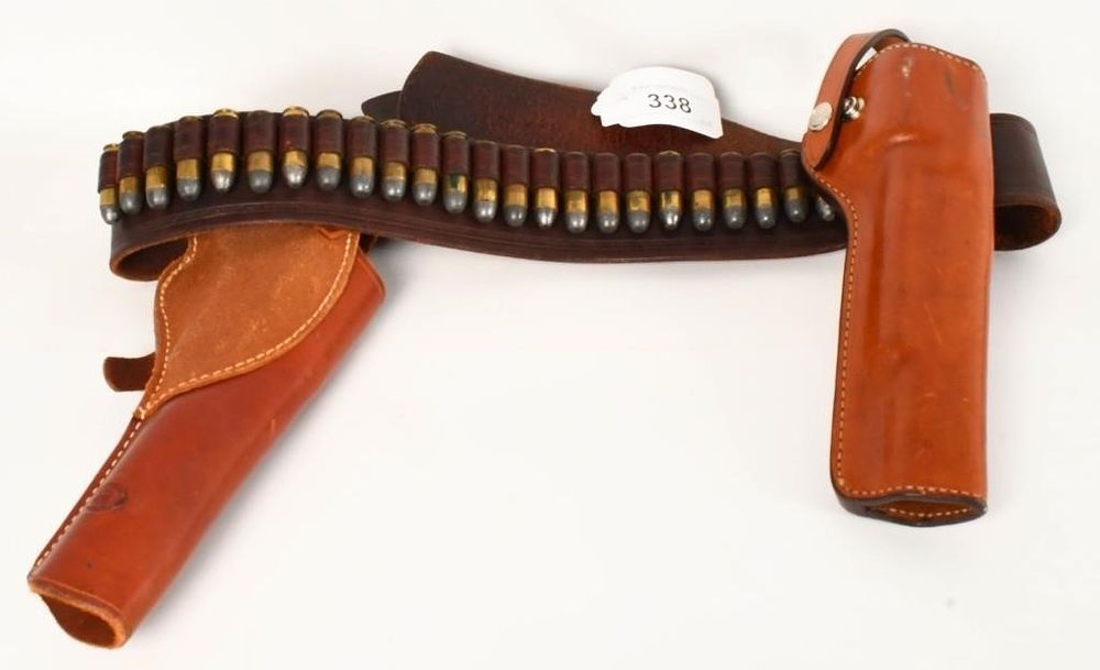 Lot 338: Leather Buscadero contains two holsters, 24 loops