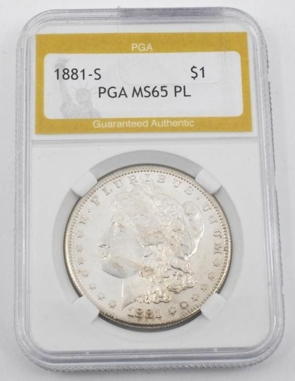 Lot 8: Uncirculated PGA Graded Morgan Silver Dollar