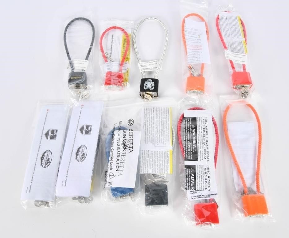 Lot 521: 11 Various Brand Gun Barrel Safety Locks