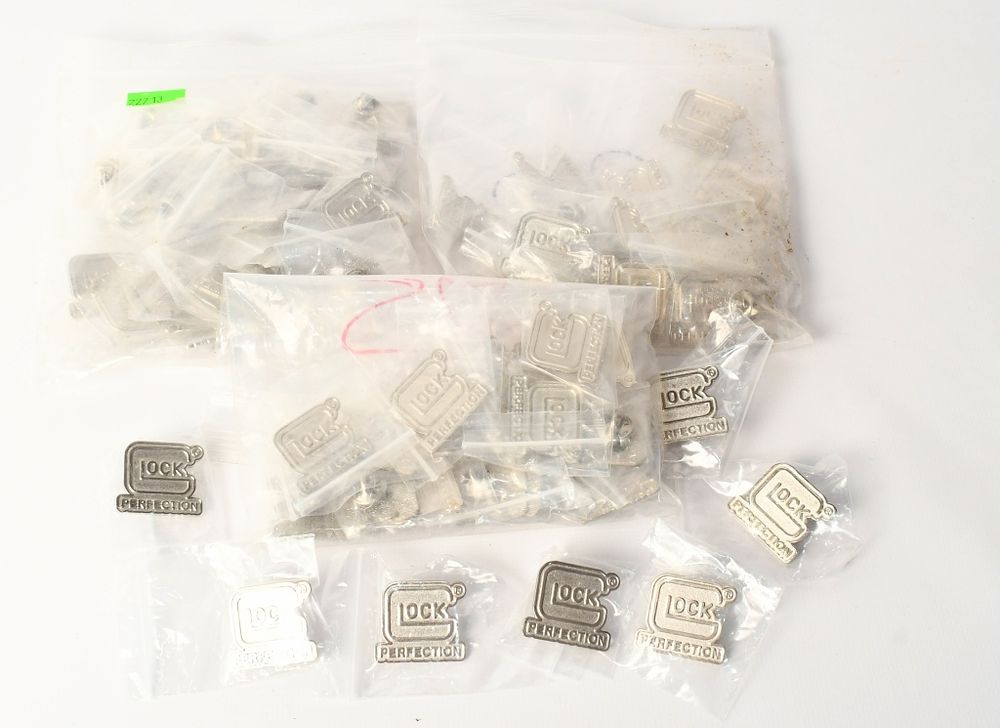 Lot 230: approx 75 New GLOCK PERFECTION lapel pins