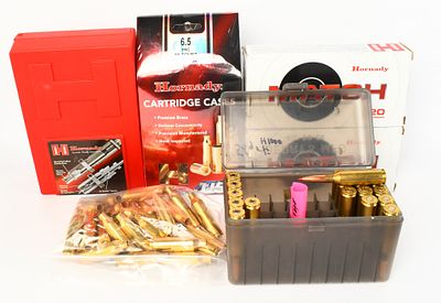 Custom Grade 6.5 die set with brass & live rds as. lot contains Custom Grade Dies 6.5 PRC by