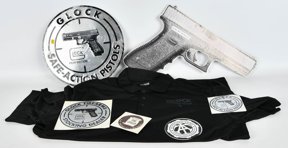 Lot 1531: Glock Lot w/shirt, stickers, and tin wall pictures