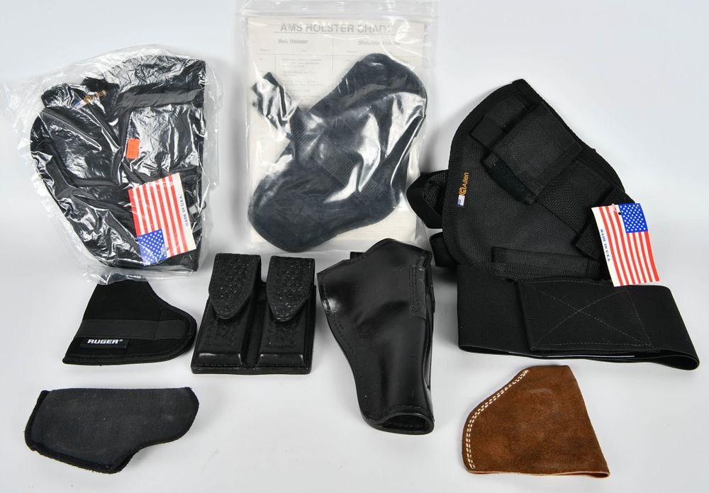 Lot 1569: 9 Various Size Holsters & Mag Pouch