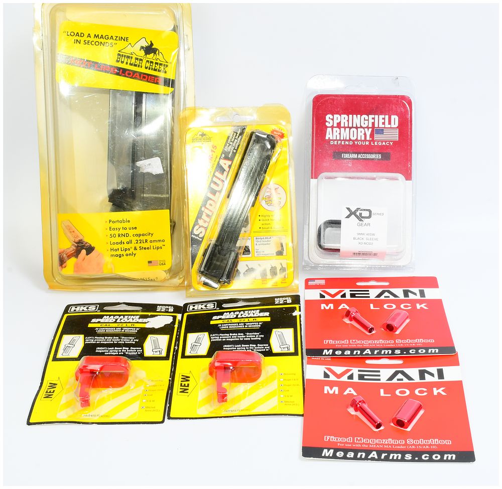 Lot 137: A Group of Six Firearm Accessories, including a Maglula M-16/AR-15 StripLULA Loader and a Butler Creek Hot Lips Loader