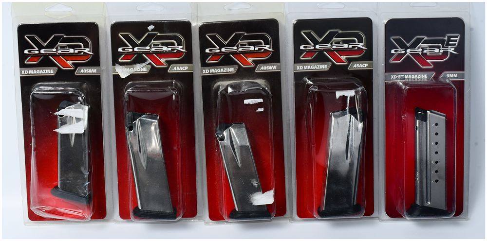 Lot 143: A Group of Five Springfield Armory XD Magazines, New in Blister Packaging, .40 S&W, .45 ACP, and 9mm