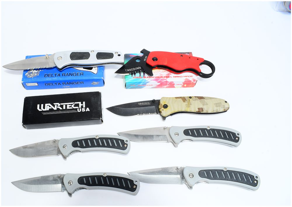 Lot 209: Seven Wartech and Other Modern Folding Knives