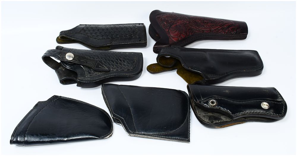 Lot 263: A Collection of Vintage Leather Police and Military Revolver Holsters, including Bucheimer and USAF Examples