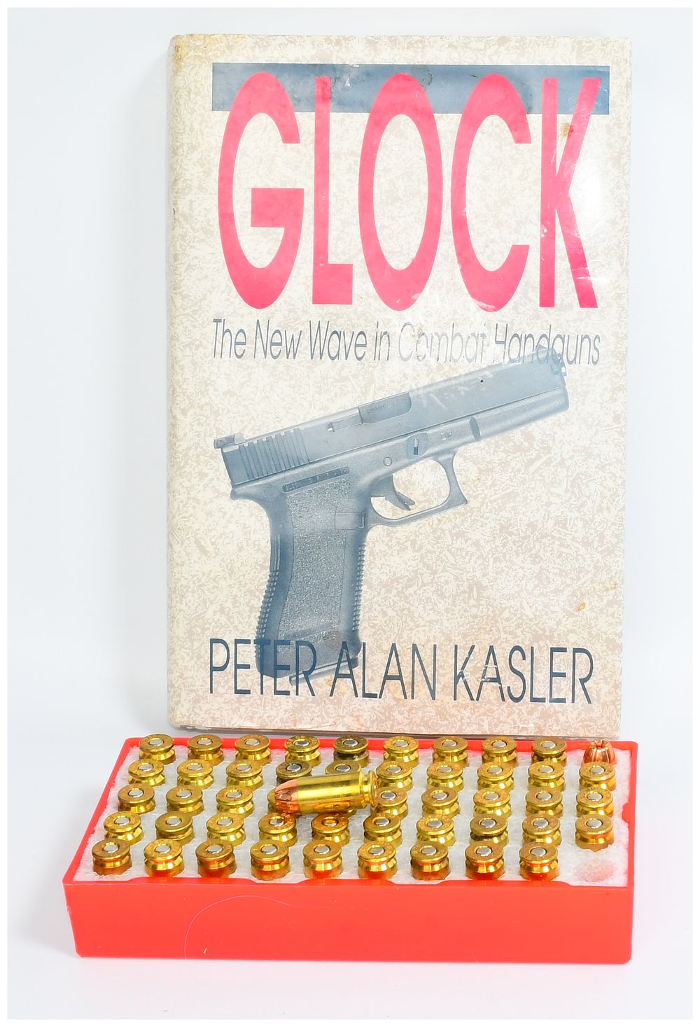 Lot 398: Glock: The New Wave in Combat Handguns by Peter Alan Kasler with a Quantity of Ammunition
