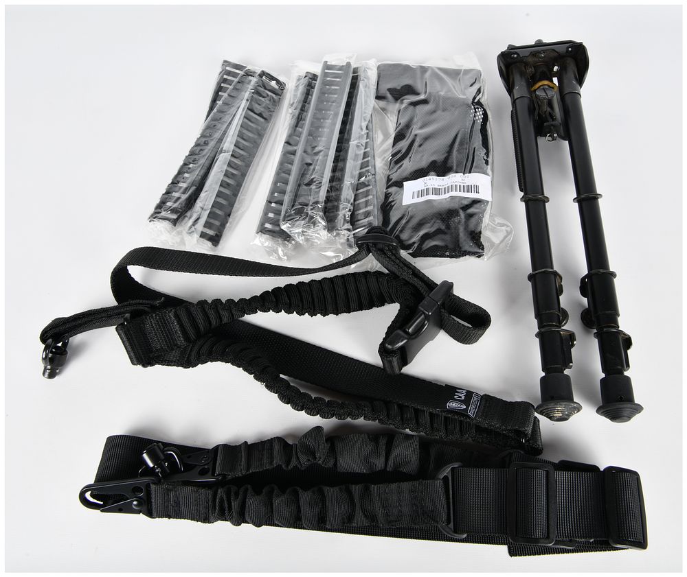 Lot 407: A Collection of Tactical Firearm Accessories, including an Adjustable Bipod, CAA Sling, and AR-15 Brass Catcher