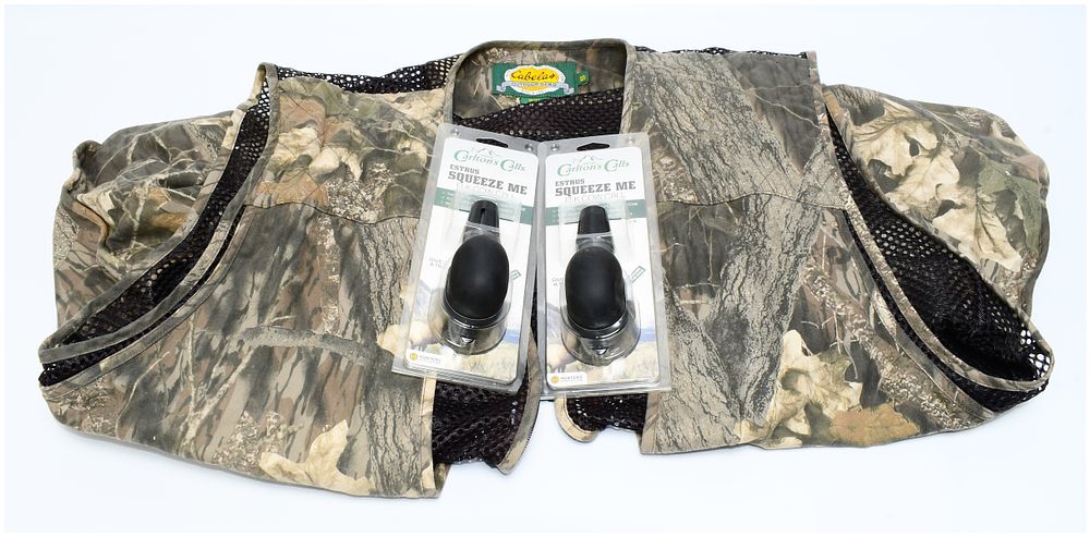 Lot 458: Cabela's Men's Mesh Hunting Vest, 4XL Regular, with Two Wayne Carlton's Estrus Squeeze Me Elk Cow Calls