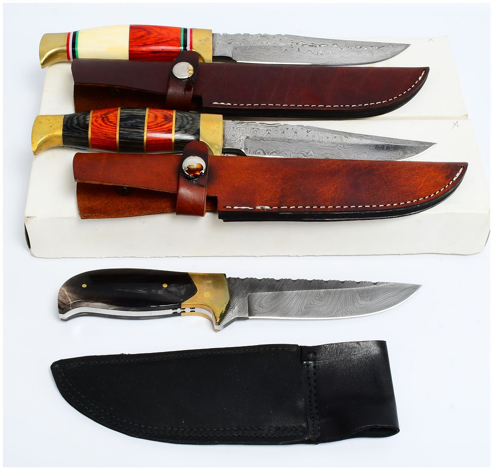 Lot 539: Three Modern Fixed-Blade Damascus Steel Hunting Knives with Segmented Wood and Horn Handles