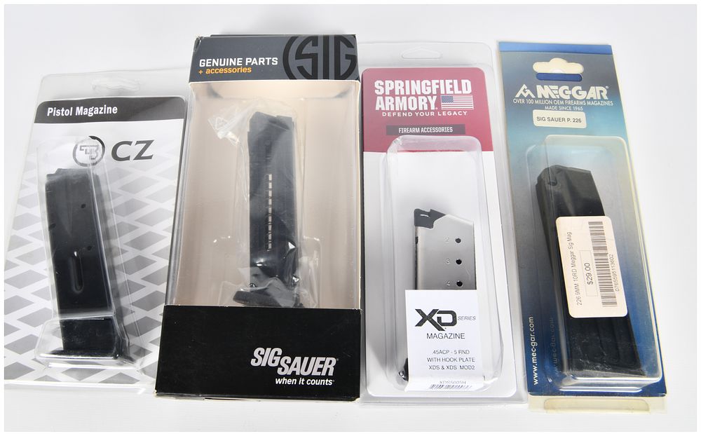 Lot 584: A Group of Four New Pistol Magazines by CZ, Sig Sauer, Springfield Armory, and Mec-Gar