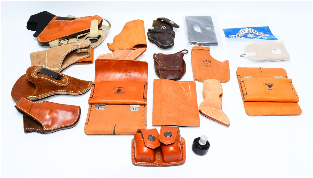 Lot 1232: A Collection of Leather Firearm Holsters and Accessories