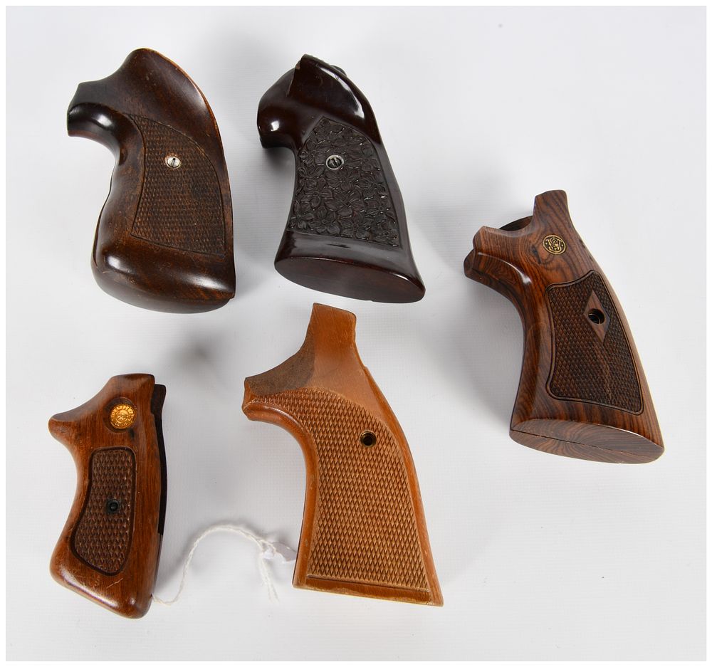 Lot 1346: A Collection of Five Assorted Wood Handgun Grips, including Smith & Wesson and Taurus