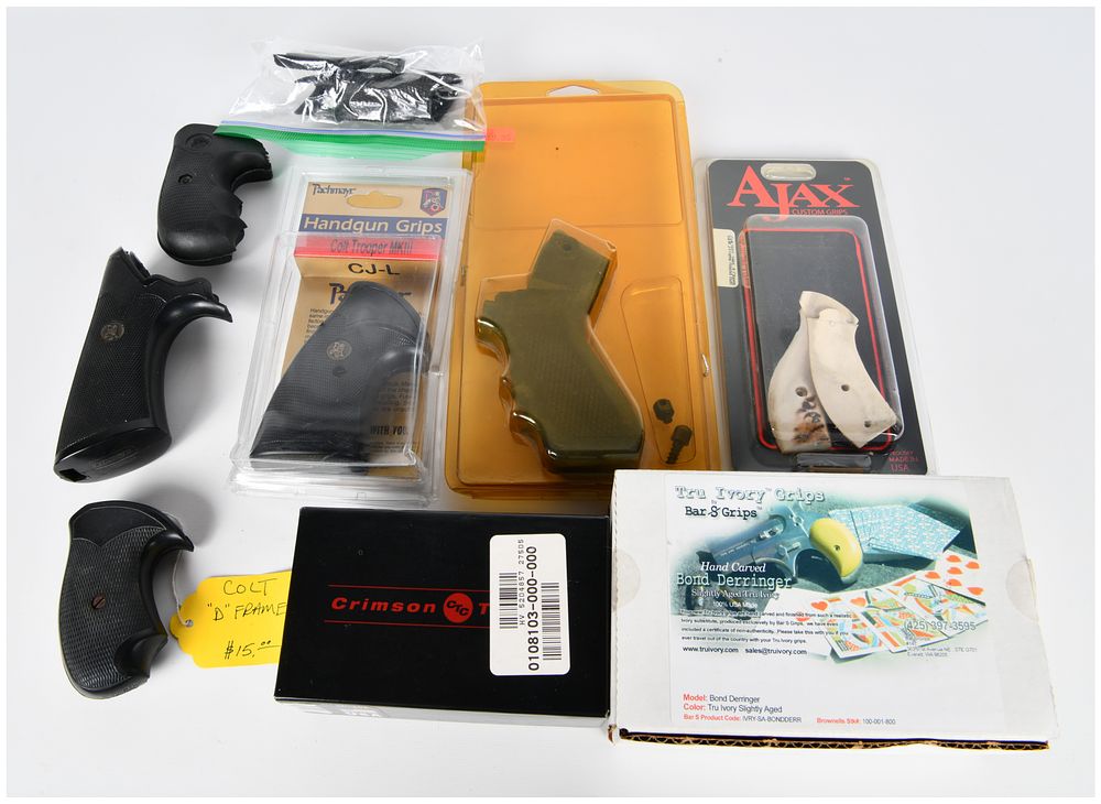 Lot 1376: A Collection of Firearm Grips, including a Mossberg 500/590/835 Pistol Grip Kit, Crimson Trace LaserGrips, Pachmayr, Ajax, and Bar S Grips