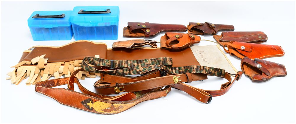 Lot 1415: A Collection of Leather Holsters, Belts, and Firearm Accessories