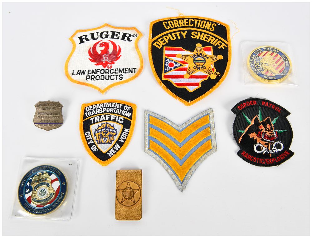 Lot 1436: A Collection of Modern Law Enforcement, Security, and Commemorative Memorabilia, including Patches and Challenge Coins