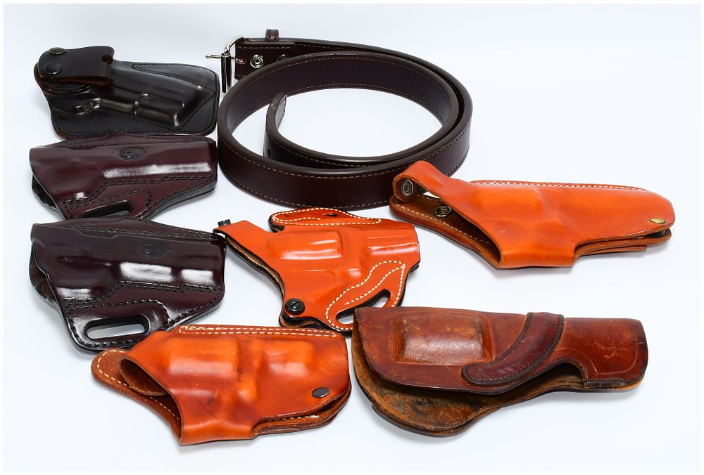 Lot 1442: A Collection of Leather Firearm Holsters and a Belt