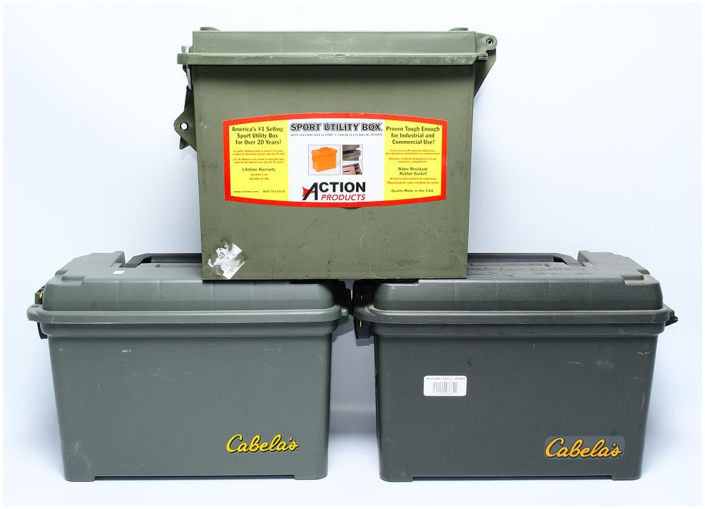 Lot 1445: Three Large Size MTM Sport Utility Dry Boxes, including Action Products and Cabela's branded examples