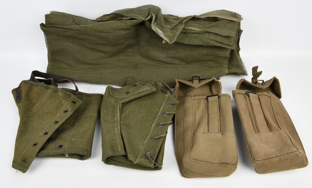 Lot 170: A Group of U.S. WWII Military Surplus Gear, including M1938 Canvas Leggings, Khaki Utility Pouches, and a BG-150-A Antenna Bag