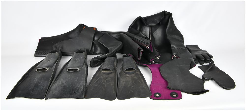 Lot 565: A Collection of Vintage Diving Equipment, including a Wetsuit and Three Pairs of Fins by Cressi, U.S. Divers, and Sporasub