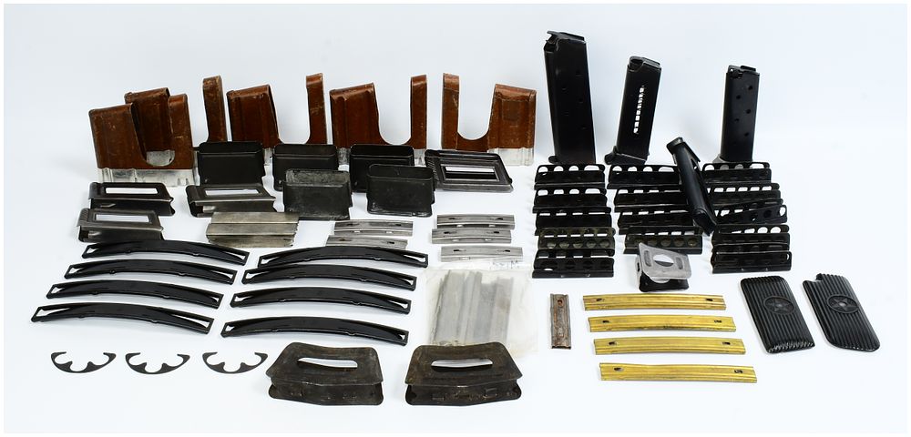 Lot 1115: A Collection of Various Stripper Clips, Half Moon Clips, Magazines, and Grips, including Swedish Mauser M96