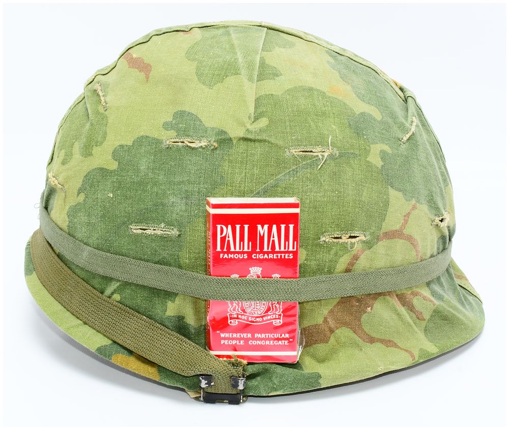 Lot 1273: U.S. Vietnam War M1 Helmet with Mitchell Pattern Camouflage Cover and Pall Mall Cigarettes