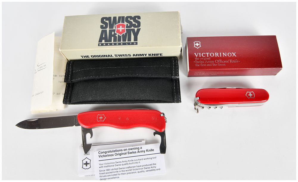 Lot 1534: A Pair of Victorinox Swiss Army Multi-Tool Pocket Knives, including an 'Adventurer Swiss' model, with Original Packaging
