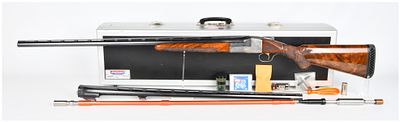 An Ithaca Gun Co. Engraved Skeet Shotgun 12 Gauge Two Barrel Set, one 34" barrel and one 32" barrel.